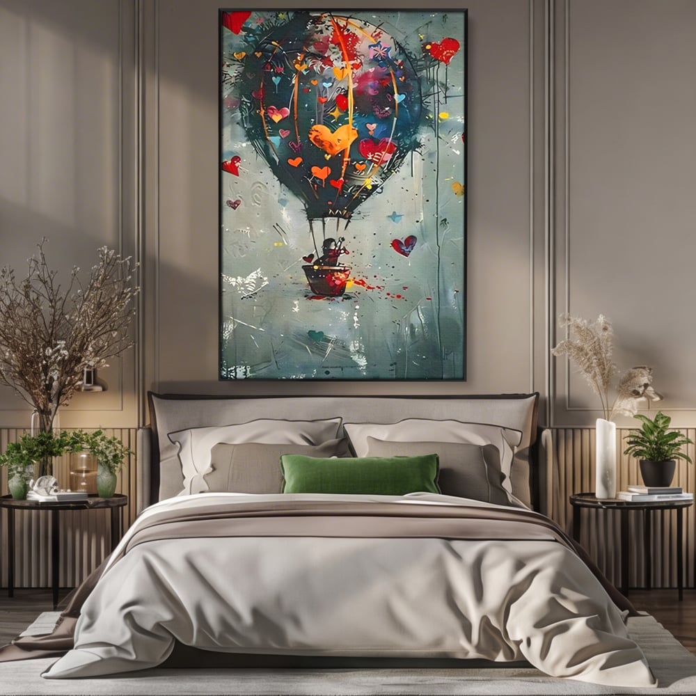 Tablou canvas cu tablou canvas cu balon cu aer cald si inimi, in rama de aluminiu negru, pe perete intr-un dormitor